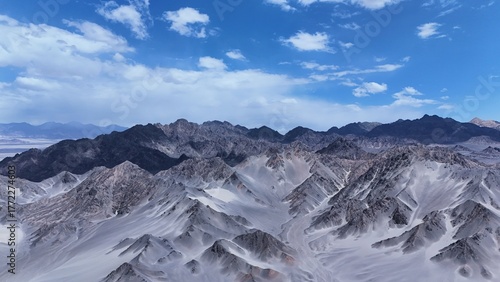 Black Mountain desert mountain landscape,Black Mountain peaks under blue sky,Majestic and desolate scenery of Black Mountain,Black Mountain scenery on the western plateau,Black mountains with blue sky