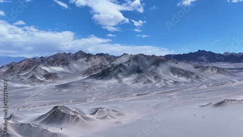 Black Mountain desert mountain landscape,Black Mountain peaks under blue sky,Majestic and desolate scenery of Black Mountain,Black Mountain scenery on the western plateau,Black mountains with blue sky