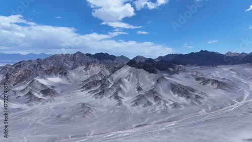 Black Mountain desert mountain landscape,Black Mountain peaks under blue sky,Majestic and desolate scenery of Black Mountain,Black Mountain scenery on the western plateau,Black mountains with blue sky