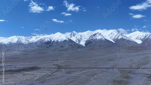 Magnificent plateau snow mountain scenery,Snowy mountain peaks under blue sky,Snow mountains and blue sky on the Tibetan Plateau,Pure plateau snow mountain landscape,Majestic plateau mountain scenery