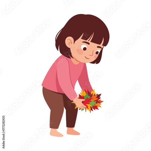 A young girl with brown hair is gathering colorful autumn leaves in her hands, looking down.