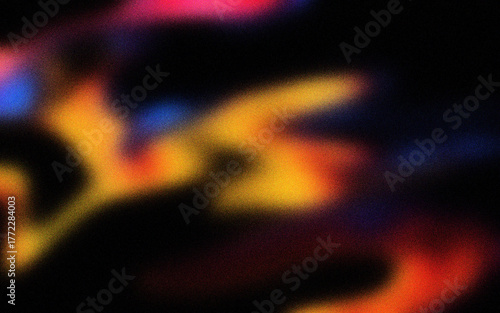 Abstract blurry colorful light streaks on black background