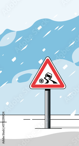 Road sign warning of slippery conditions in a blizzard