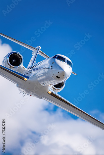 Private jet flying in clear blue