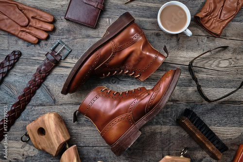 Wingtip Brogue Boots and Accessories on Wooden Table