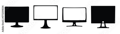 Four different computer monitors or screens, some black silhouettes and some with white screens, displayed side by side on a