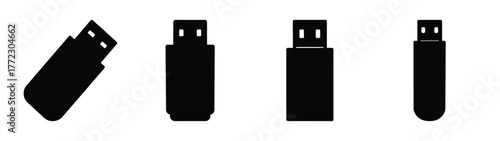 Four black usb flash drives displayed in various angles and orientations ready for data storage