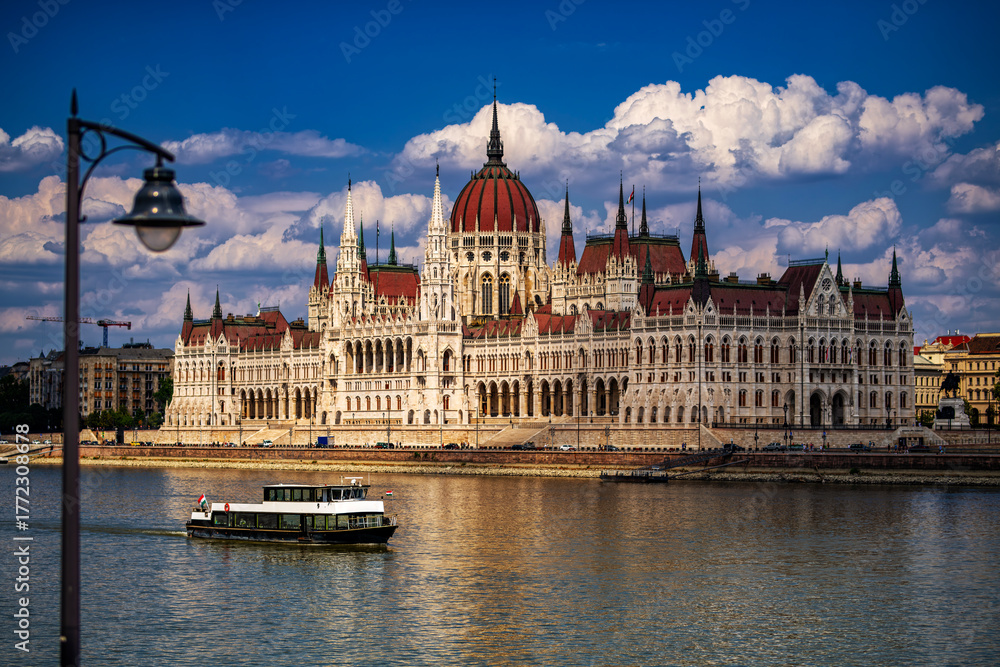 Fototapeta premium Hungarian Parliament Building on Danube River in Budapest. Budapest Parliament with reflection in water. Iconic Hungarian landmark. Budapest cityscape with Parliament.