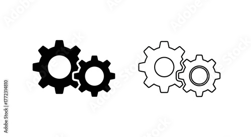 Two sets of interlocking gears one black and one white outline