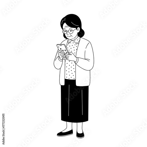 Older woman using smartphone and smiling while standing indoors  