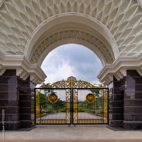 Photography Ornate golden gates and grand archway of Istana Negara, the Royal Palace, in Kuala Lumpur, Malaysia