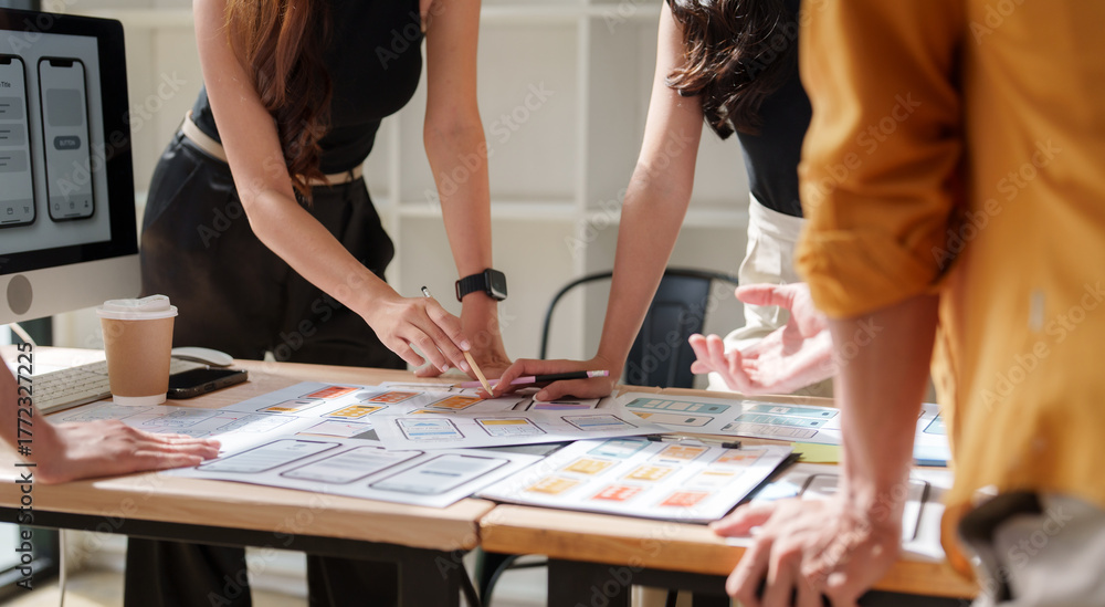 Fototapeta premium Design team collaborating on mobile application ux ui