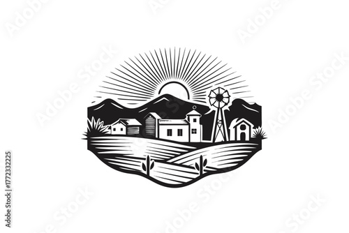 Sunrise over rolling hills casts light on a simple rural farmstead landscape view