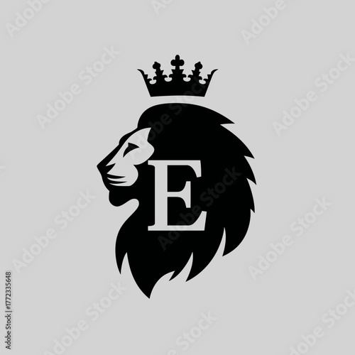 Majestic black lion head profile with royal crown and capital letter E, elegant heraldic emblem on gray background
