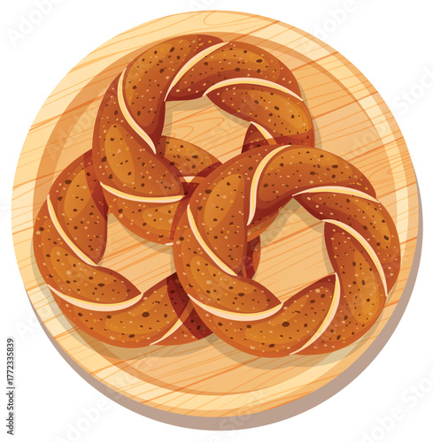 Three Twisted Bagels on Wooden Plate Top View