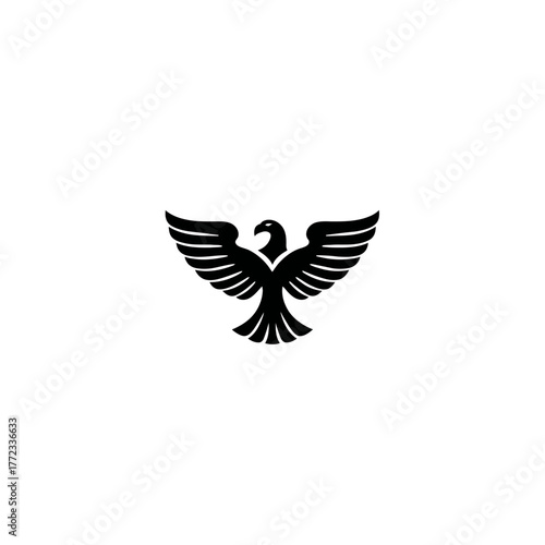 Stylized majestic eagle silhouette with spread wings flying, minimalist vector illustration. Powerful predatory bird symbol.