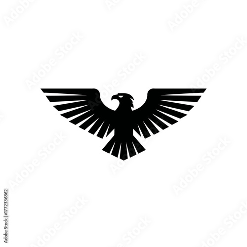 Stylized black eagle silhouette with powerful spread wings, majestic bird of prey vector graphic design element, strength and freedom symbol.
