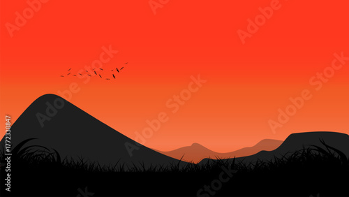 A beautiful sunset landscape with a glowing sun, flying birds, and grassy silhouettes
