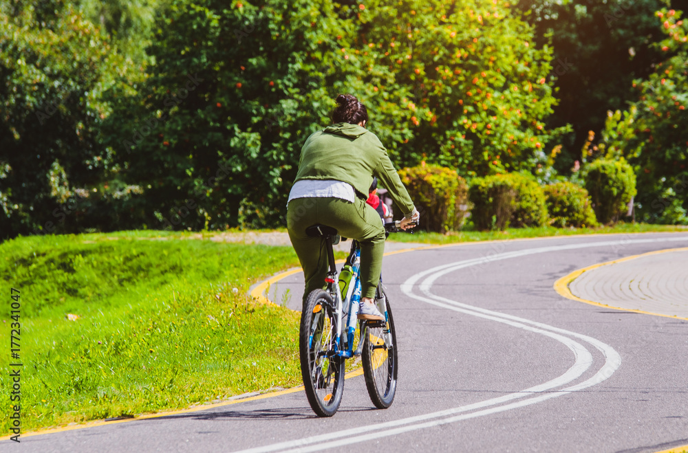 Fototapeta premium Cyclist ride on the bike path in the city Park 