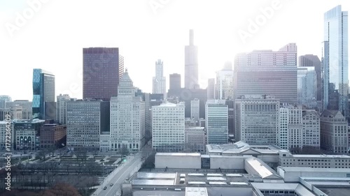 Aerial drone video booming up showing the cars in traffic and skyline buildings in downtown Chicago, Illinois.