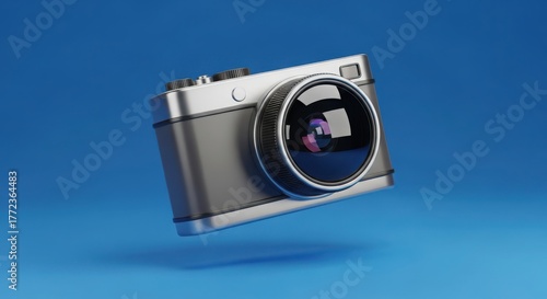 Silver camera is floating on a blue background in a 3d rendering style
