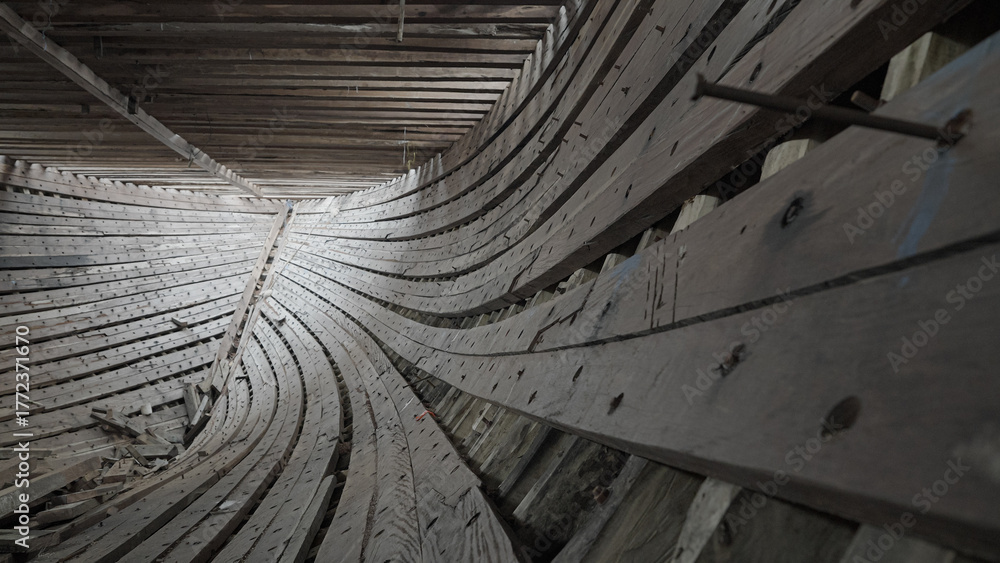 Fototapeta premium The stringer and frame sections in the construction of a traditional Phinisi wooden ship are linked to each other with bolts and pegs.