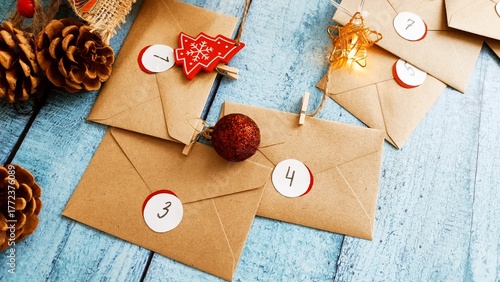 Preparing an Advent calendar for Christmas. Eco-craft envelopes with numbers for children. Christmas background, Advent from small craft envelopes.