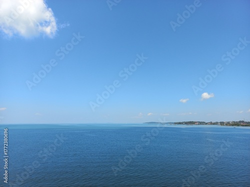 Ocean view with water color gradation and clear blue sky