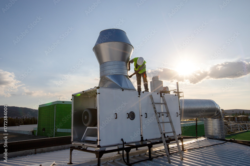 Obraz premium cloudy sky factory roof and ventilation systems