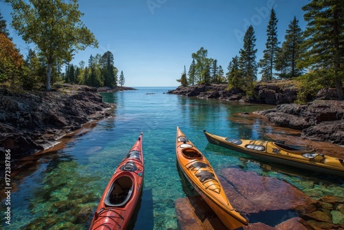 Fototapeta Naklejka Na Ścianę i Meble -  Canoes and Kayaks Docked on Northern Waters of Madeline Island in Lake Superior, Wisconsin