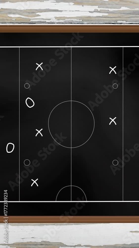 Animation of sports tactics over game pitch on blackboard background