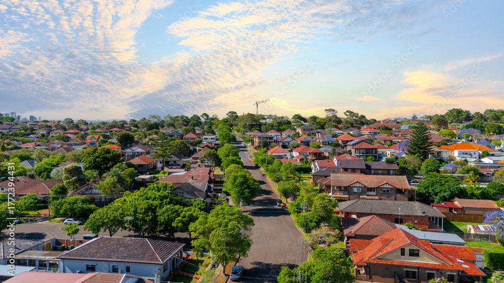 Fototapeta premium Panorama Sunset aerial drone view of western Sydney Suburbs of Canterbury Burwood Ashfield Marrickville Campsie with Houses roads and parks in Sydney New South Wales NSW Australia