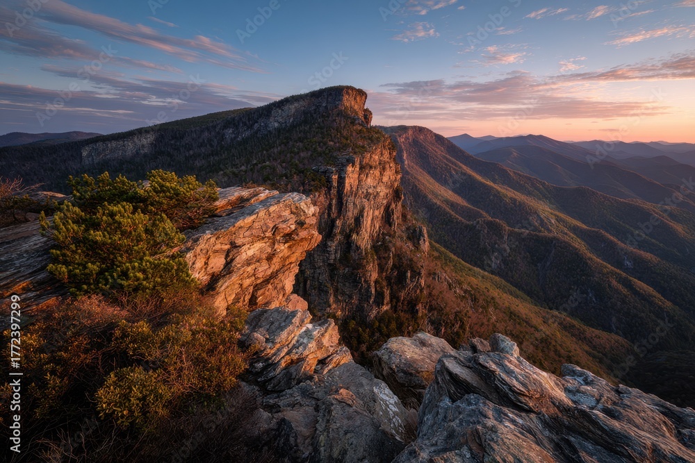 Fototapeta premium Linville Gorge: Majestic Cliffs of Blue Ridge in North Carolina during Sunset with a Vibrant Sky and Scenic Mountain Landscape