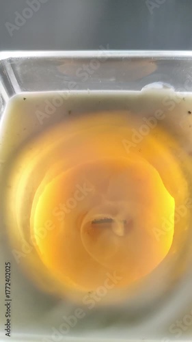 Flame fading and smoke from a decorative scented candle