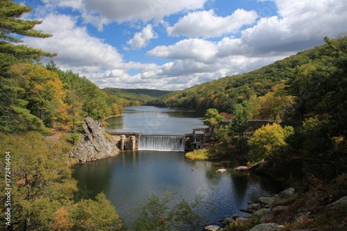 Fototapeta Naklejka Na Ścianę i Meble -  Scenic Dam on Aspetuck Reservoir: A Tranquil Lake in Fairfield County, Connecticut Surrounded by Nature and Mountains