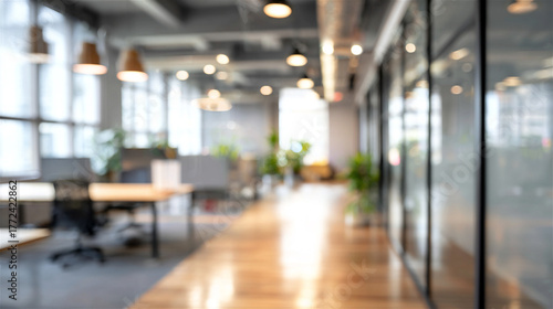 Wallpaper Mural Blurred abstract background showing a modern office space featuring desks, lighting, and glass partitions, conveying concepts of contemporary business, innovation, and an empty workplace Torontodigital.ca