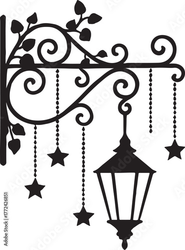 Ornate black street lamp with hanging stars and vine accents