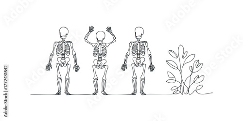 Three skeletons one with arms raised stand beside foliage
