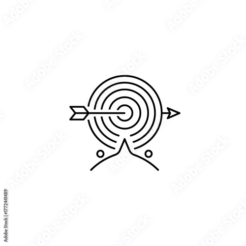 Arrow pierces target atop landscape