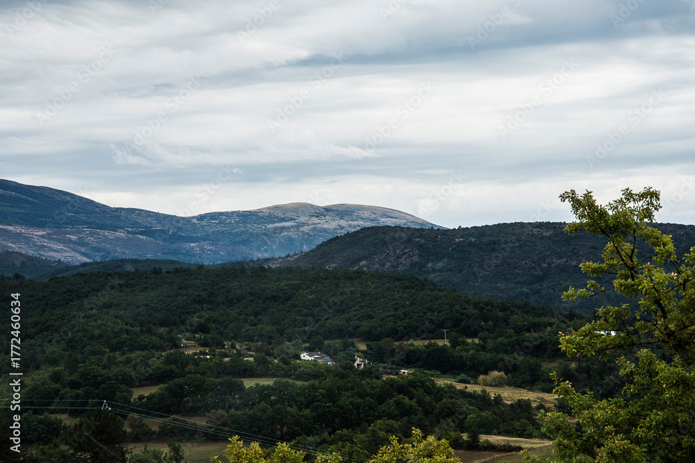 Fototapeta premium landscape with hills under a dark clouded sky in the French region of the Verdon