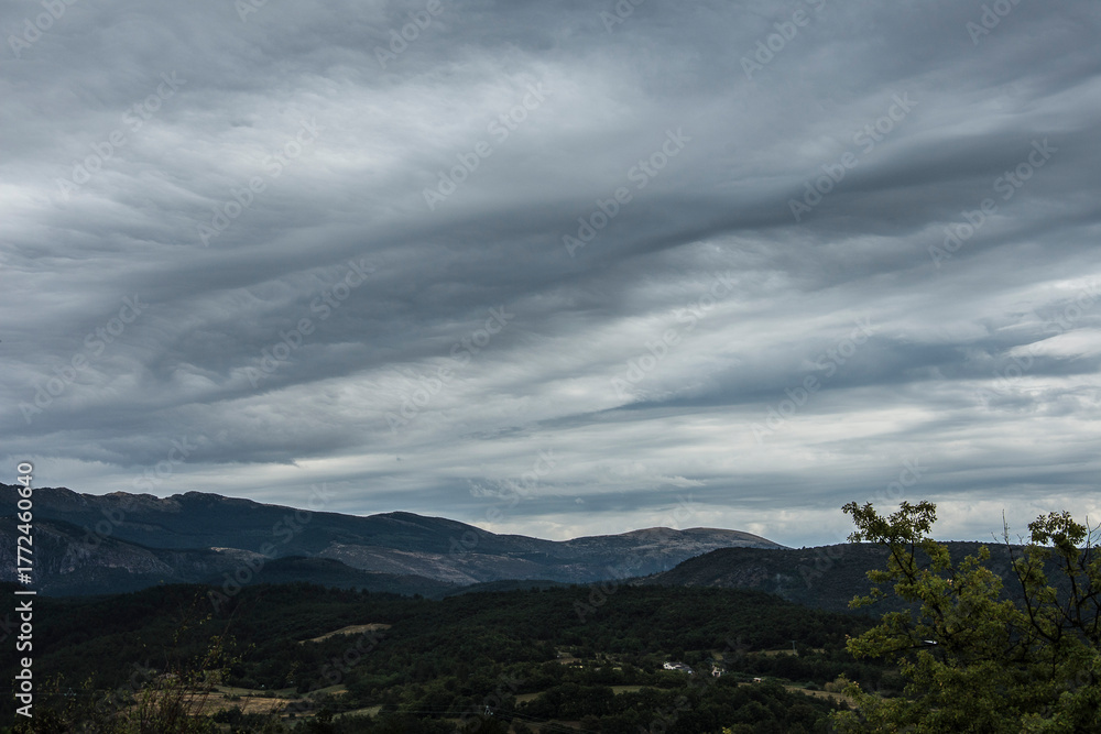 Fototapeta premium landscape with hills under a dark clouded sky in the French region of the Verdon