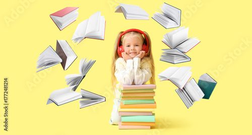 Cute little girl in headpho...