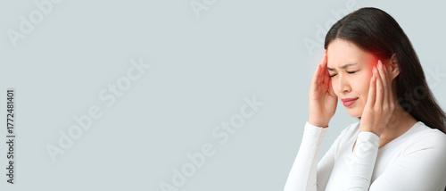 Young Asian woman suffering...