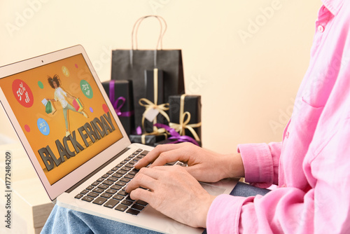 Woman with laptop shopping ...