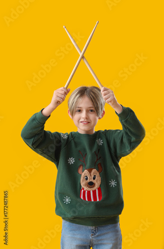 Cute little boy with drumst...