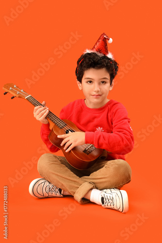Cute little boy in Santa ha...