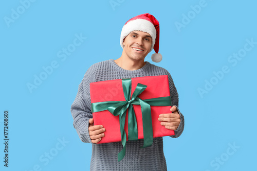 Handsome young man in Santa...