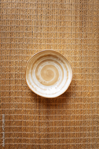 Plate on bamboo background. Mockup empty plate on Japanese style background