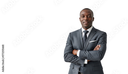 A professional portrait of a man in a suit with crossed arms, against transparent background