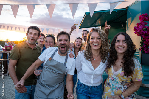 Sticker Diverse friends laughing at outdoor food truck party